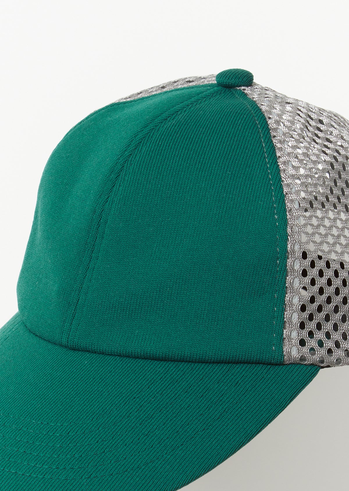 Close-up detail of Rototo Jersey 6 Panel Mesh Cap in dark green
